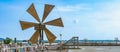 Wooden turbine at salt pan using for press seawater up to field with blue sky background in summer time of Thailand,South East Royalty Free Stock Photo