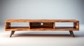 a wooden TV stand with shelves for electronics, emphasizing its functional design