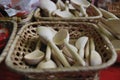 Wooden unpainted spoons lay in the basket Royalty Free Stock Photo