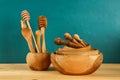 Wooden utensils. Wooden plates, cups, bowls. Dishes on shelf. Kitchenware