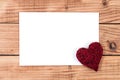 Love Frame: Blank White Paper on Wooden Background with Heart Detail Royalty Free Stock Photo