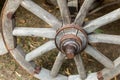Wooden van wheel gray close up on ground background Royalty Free Stock Photo