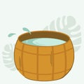 Wooden vat with water for baths and saunas. Spa treatments with a cedar barrel. A hot tub for outdoor relaxation and