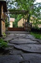 Wooden veranda overlooking the courtyard with trees Royalty Free Stock Photo