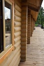 Wooden veranda overlooking the courtyard with trees Royalty Free Stock Photo