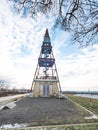 Wooden view tower with spiral staircase and wooden beams