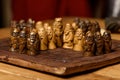 Wooden Viking chess hnefatafl on a wooden carved board made of dark wood