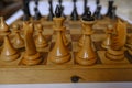 Wooden vintage chess pieces on a chessboard close-up. Playing chess. Strategy concept Royalty Free Stock Photo