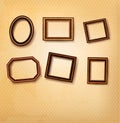 Wooden vintage frames on old wall. Royalty Free Stock Photo