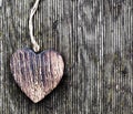 A wooden vintage heart on grunge wood planks. Love