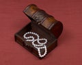 Wooden vintage jewelry box with freshwater white pearls Royalty Free Stock Photo