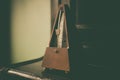 Wooden vintage metronome Royalty Free Stock Photo