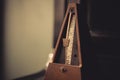 Wooden vintage metronome Royalty Free Stock Photo