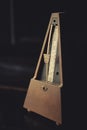 Wooden vintage metronome Royalty Free Stock Photo