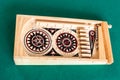 Wooden vintage pinball game on green baize table