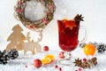 Wooden vintage rustic christmas decoration and hot mulled spiced red wine in glass mug Interior eco decor. Royalty Free Stock Photo