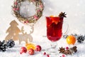 Wooden vintage rustic christmas decoration and hot mulled spiced red wine in glass mug Christmas or new year card Royalty Free Stock Photo