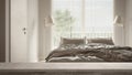 Wooden vintage table top or shelf closeup, zen mood, over cosy peaceful bedroom bedroom with double bed, blankets, pillows, duvet Royalty Free Stock Photo