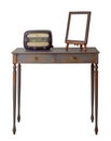 Wooden vintage table with two drawers painted in grey and orange, wooden ornate brown desktop photo frame and old radio