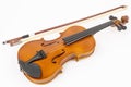 Wooden Violin with Fiddle Bow isolated above white background Royalty Free Stock Photo