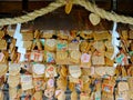 Wooden votive plaque Ema`s hanging at Tsuyunoten Shrine