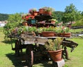 wooden wagon decorated with many pots of flowers Royalty Free Stock Photo