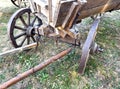 A wooden wagon with a wooden wheel and a wooden axle Royalty Free Stock Photo