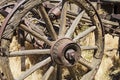 Ancient western wooden wagon wheel axle weathered Royalty Free Stock Photo