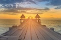 Wooden walk leading to sea coast sunset skyline Royalty Free Stock Photo