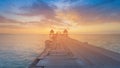 Wooden walk leading to seacoast sunset skyline Royalty Free Stock Photo