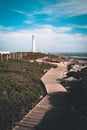 Wooden walk way leading to a lighthouse