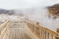 Wooden walk way near hot spring at Noboribetsu Jigokudani Hell Valley: The volcano valley got its name from the sulfuric smell. Royalty Free Stock Photo