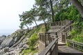 The wooden walk way over the rock cilff in Haeundae Dongbaekseom Island near Haehundae beach Royalty Free Stock Photo