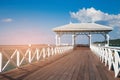 Wooden walking path leading to seacoast skyline Royalty Free Stock Photo