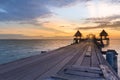 Wooden walking path leading to seacoast skyline Royalty Free Stock Photo