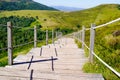 Wooden walking path in puy de dome french mountains in summer day