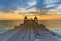 Wooden walking way leading to seacoast to abandon temple Royalty Free Stock Photo