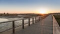 Wooden walkway in Alvor, Algarve at sunset