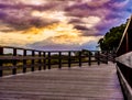 Wooden walkway with amaziung sunset on the promenade of marbella on the costa del sol