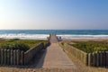 Wooden Walkway Through Dune Vegetation Pxtending onto pier Royalty Free Stock Photo