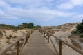 Wooden walkway through the dunes of access to the beach of Cadiz Royalty Free Stock Photo