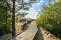 Wooden walkway through the dunes to the Gulf of Riga in Latvia. Royalty Free Stock Photo