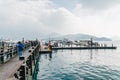 Wooden walkway the lead to the boat in Sun Moon Lake with mountain and cloud in background at Shuishe Pier in Yuchi Township.