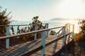 Wooden walkway leading to seashore against backdrop of sunset Sunny Summer Beach Relaxing Concept Gelendzhik