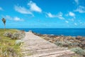 Wooden walkway near ocean coast - wood footpath