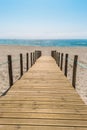 Wooden walkway over the sand dunes to the beach. Beach pathway i Royalty Free Stock Photo