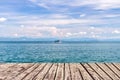 Wooden walkway on sea and blue sky with boat Royalty Free Stock Photo