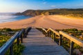 Wooden walkway to the beach Praia da Amoreira, District Aljezur, Algarve Portugal. Panorama from Amoreira beach in the Algarve Royalty Free Stock Photo