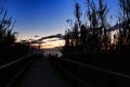 Wooden walkway to the beach at sunrise in Alicante, Spain Royalty Free Stock Photo