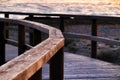 Wooden walkway to the beach at sunrise in Alicante, Spain Royalty Free Stock Photo